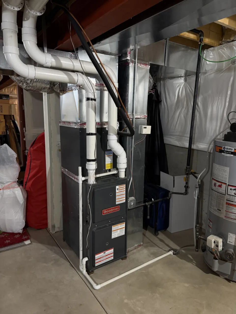 The previous Goodman furnace and its indoor coil in the Naperville basement.